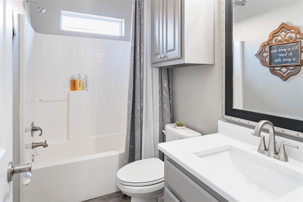 127 Rueda Encina Street Gun Barrel City, TX 75156 - Photo 31 of 39 a bathroom with a sink a toilet and a bathtub