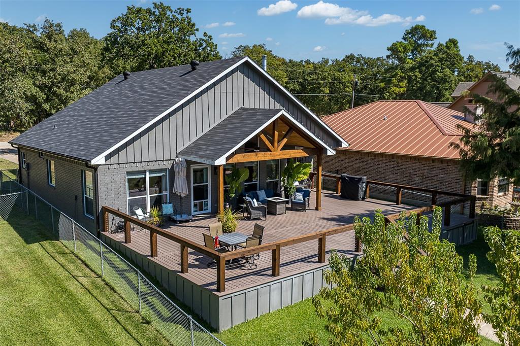 127 Rueda Encina Street Gun Barrel City, TX 75156 - Photo 32 of 39 a aerial view of a house with swimming pool and sitting area