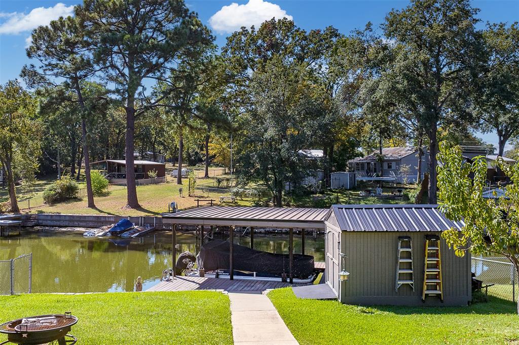 127 Rueda Encina Street Gun Barrel City, TX 75156 - Photo 37 of 39 a view of a house with swimming pool and a yard