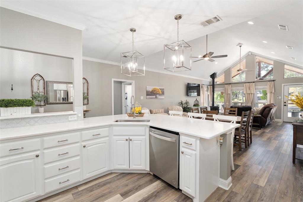 127 Rueda Encina Street Gun Barrel City, TX 75156 - Photo 7 of 39 a kitchen with lots of counter top space and painting on the wall