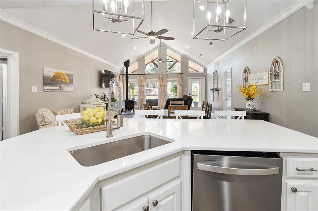 127 Rueda Encina Street Gun Barrel City, TX 75156 - Photo 8 of 39 a kitchen with a sink a counter space and stainless steel appliances