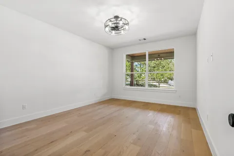 a view of a livingroom with wooden floor
