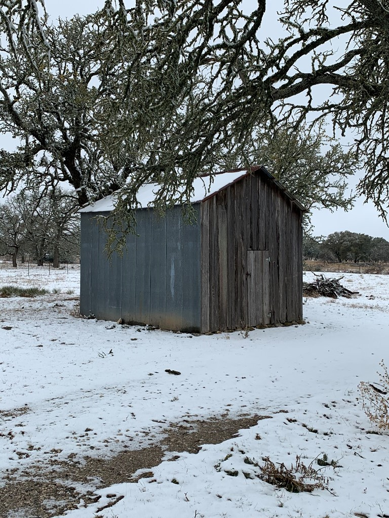 3527 Old Harper Road Fredericksburg, TX 78624 - Photo 39 of 43 a wooden fence covered with snow