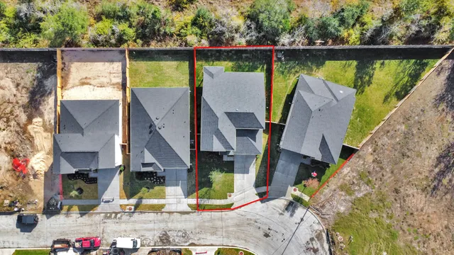 an aerial view of a house with a lake view
