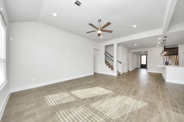 a view of a kitchen with a sink and a window