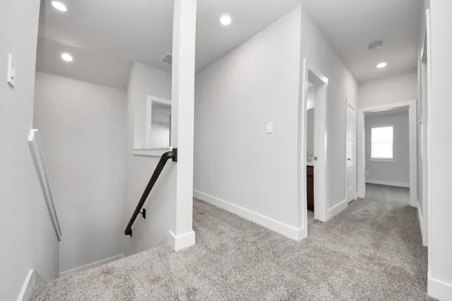 a view of a backyard with wooden fence