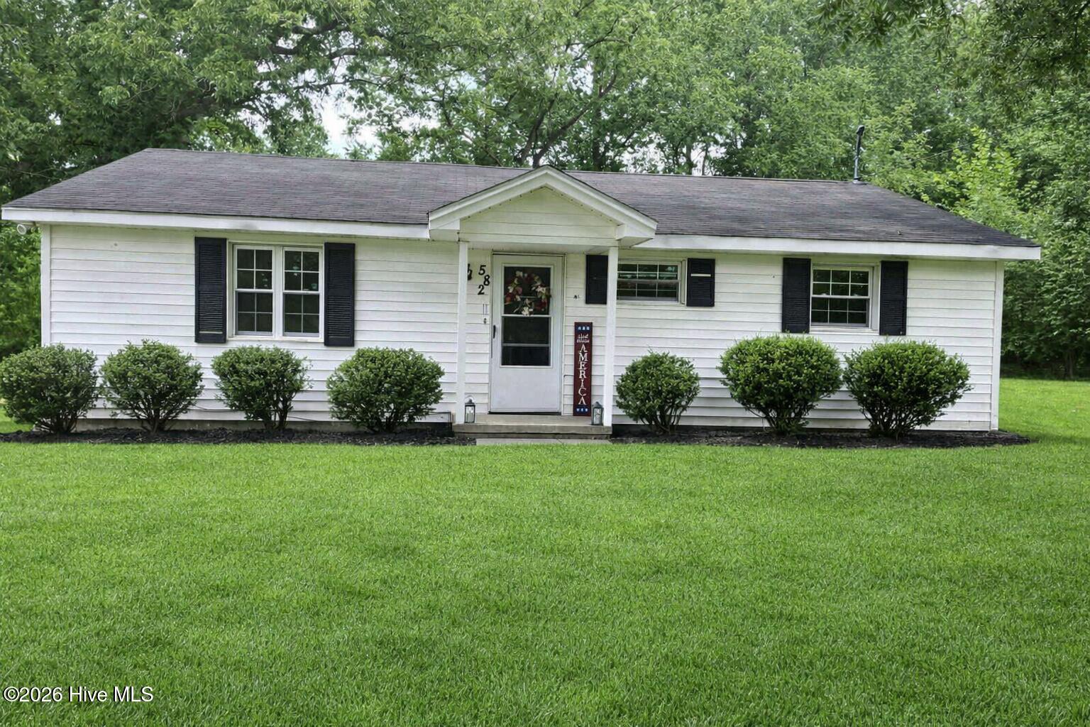 582 Saw Mill Road Rocky Mount, NC 27801 - Photo 1 of 26 Photo AI Generated to show potential landscaping
