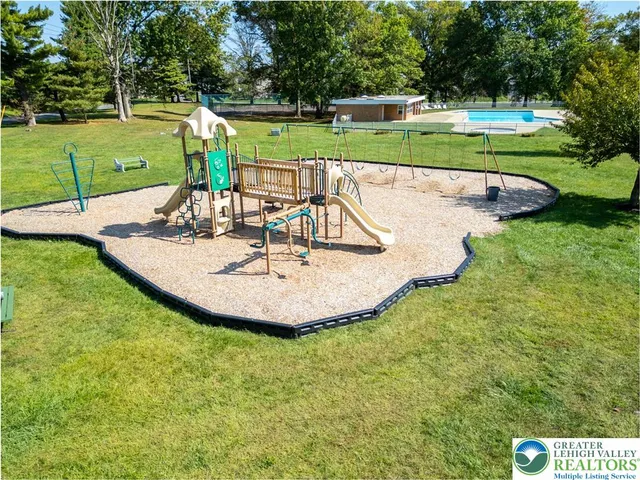 a view of a swimming pool with a slide