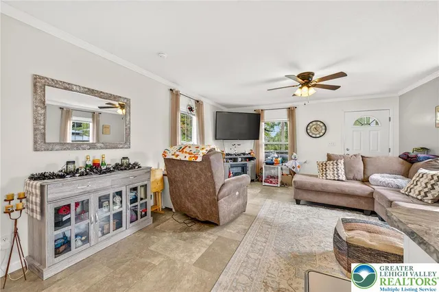 a living room with furniture and a window