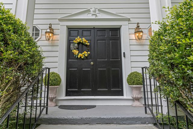 a front view of a house with a garage