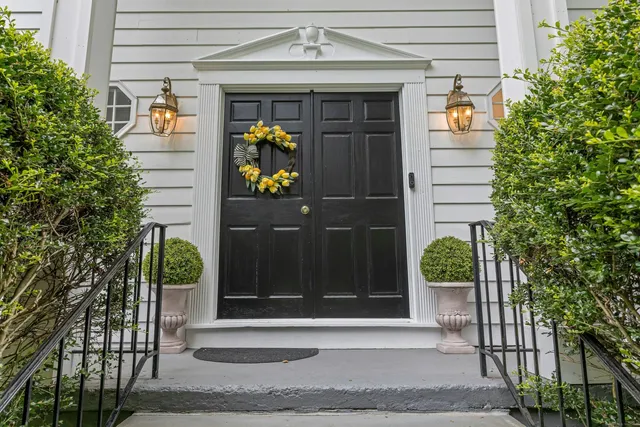 a front view of a house with a garage