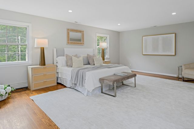 a bedroom with a bed and a table