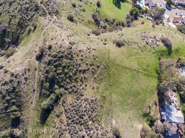 a bathroom with a bathtub and mirror