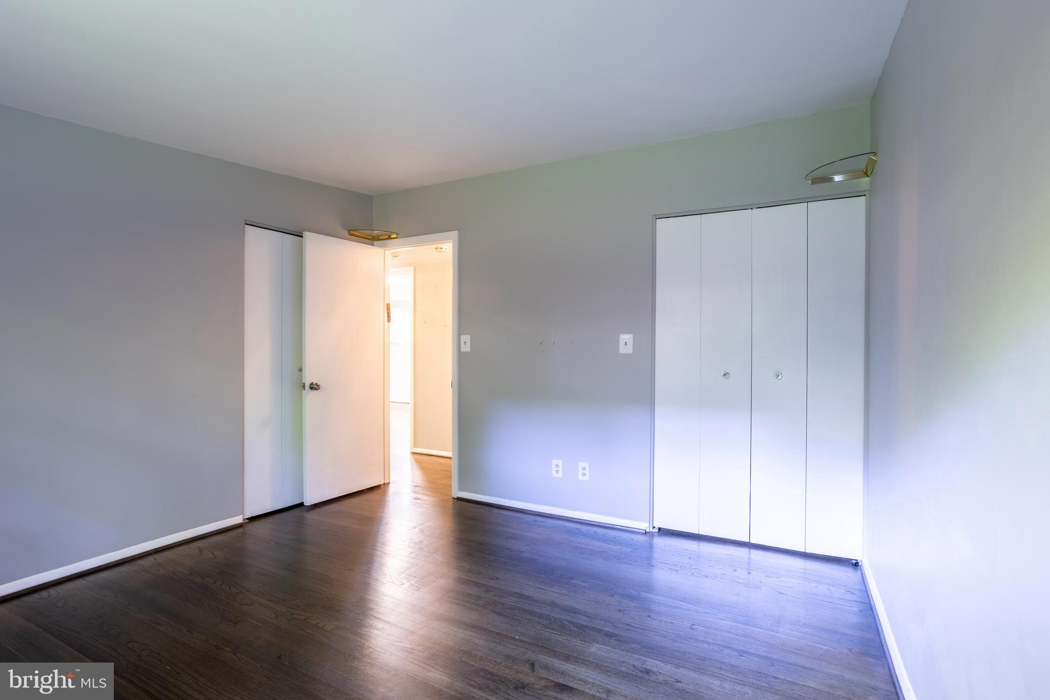 3207 Midfield Road Pikesville, MD 21208 - Photo 24 of 45 a view of an empty room with wooden floor and closet