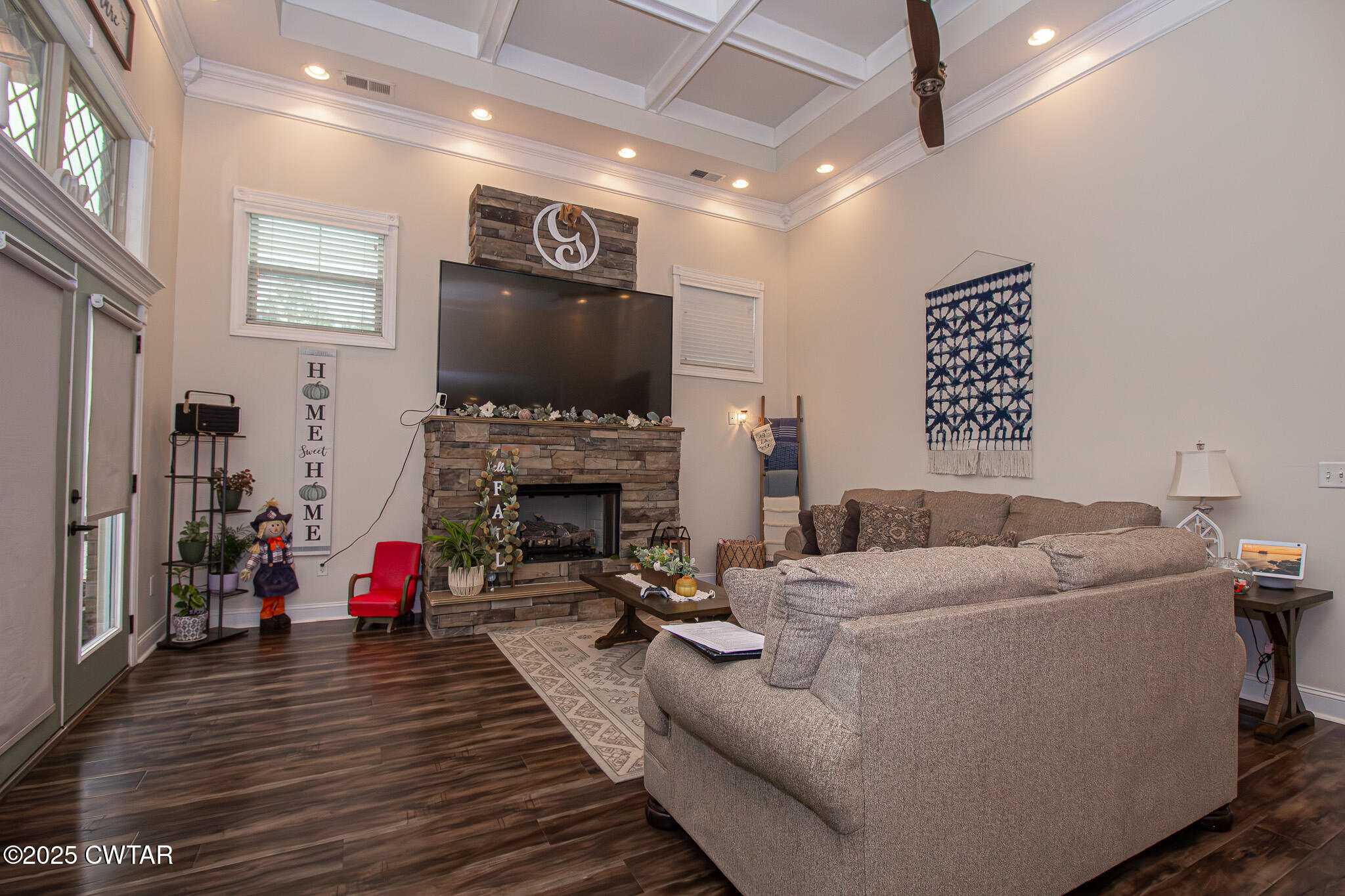 175 Ridgewood Drive Henderson, TN 38340 - Photo 14 of 43 a living room with furniture a flat screen tv and a fireplace