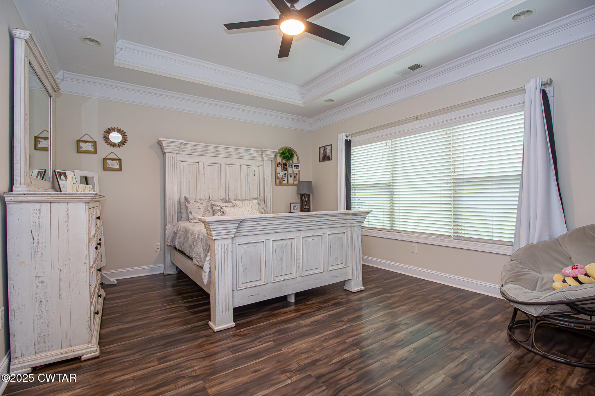 175 Ridgewood Drive Henderson, TN 38340 - Photo 17 of 43 a bedroom with a bed and wooden floor