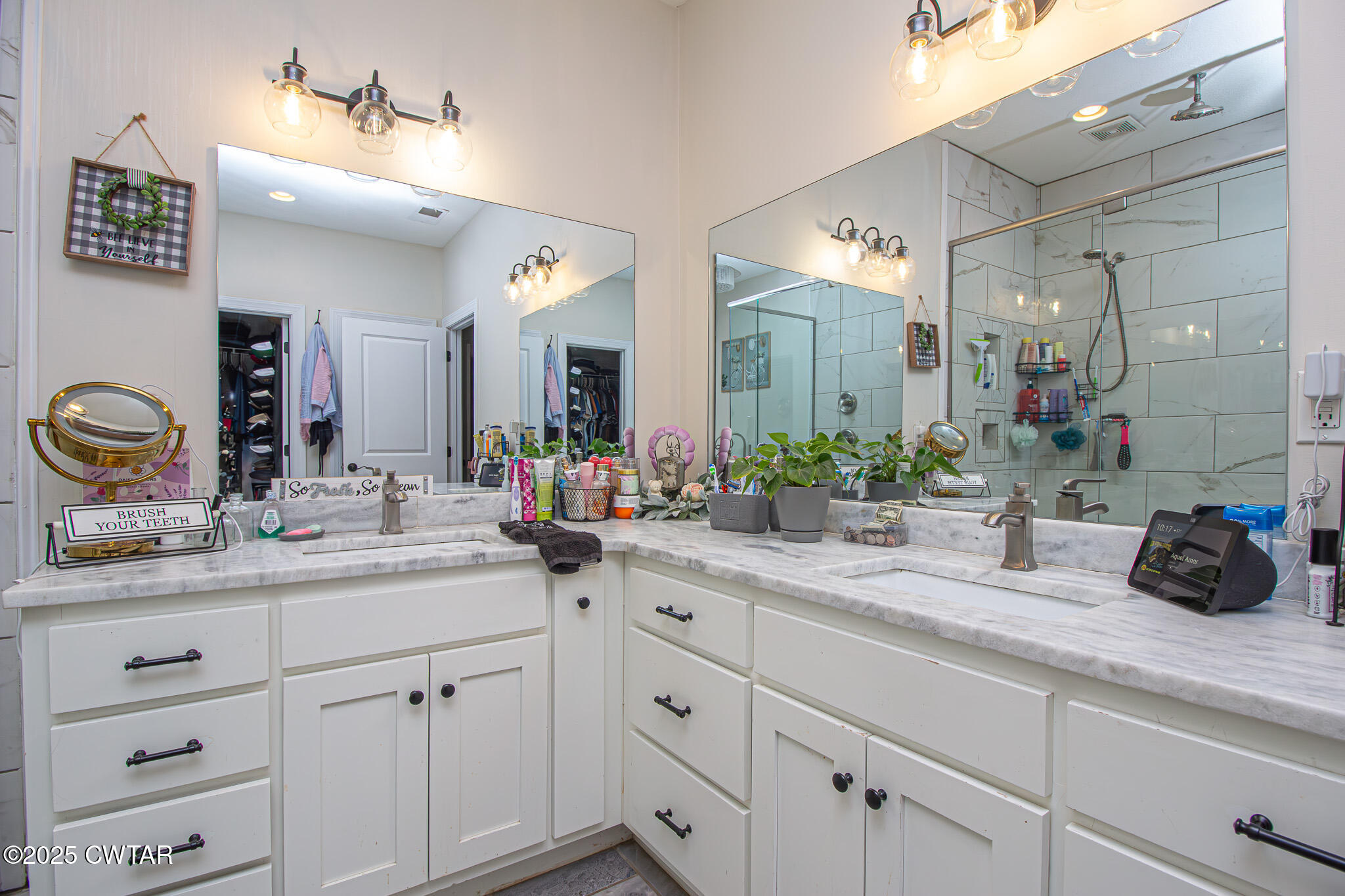 175 Ridgewood Drive Henderson, TN 38340 - Photo 20 of 43 a bathroom with a double vanity sink and a mirror