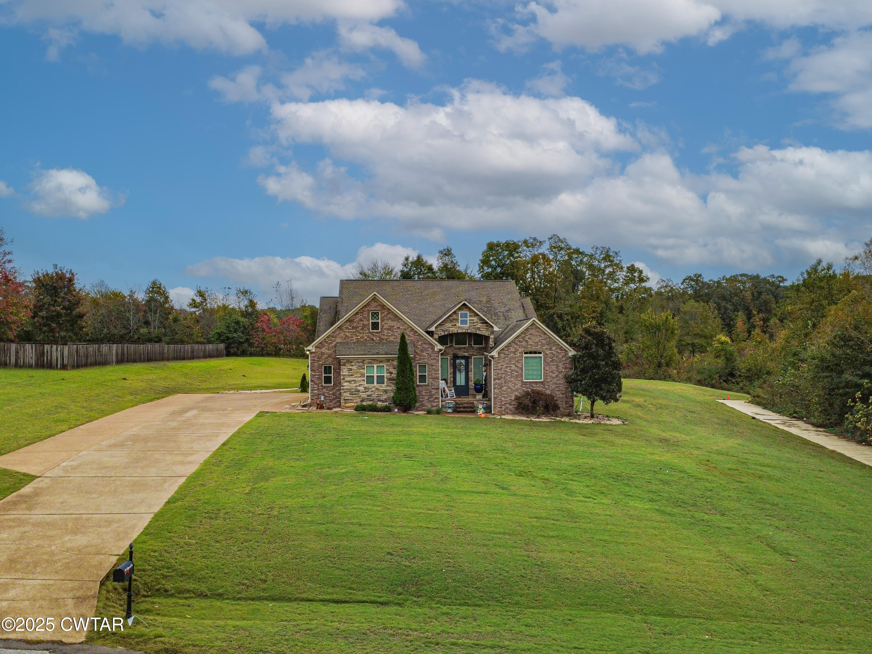 175 Ridgewood Drive Henderson, TN 38340 - Photo 2 of 43 a view of a house with a big yard