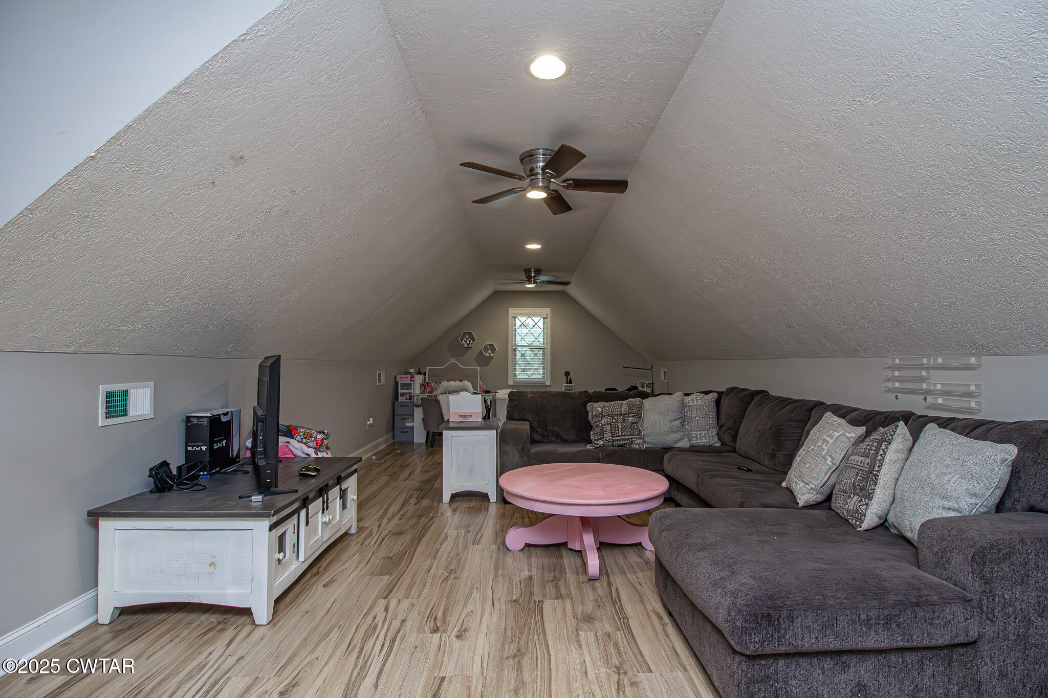 175 Ridgewood Drive Henderson, TN 38340 - Photo 26 of 43 a living room with furniture and a wooden floor