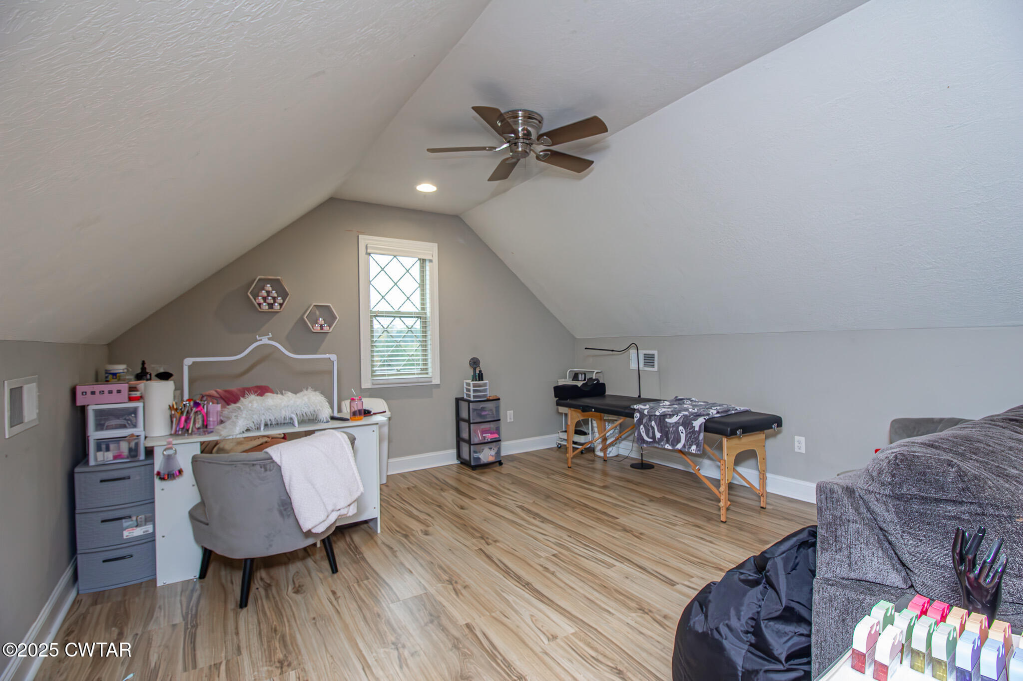 175 Ridgewood Drive Henderson, TN 38340 - Photo 27 of 43 a living room with furniture and a wooden floor
