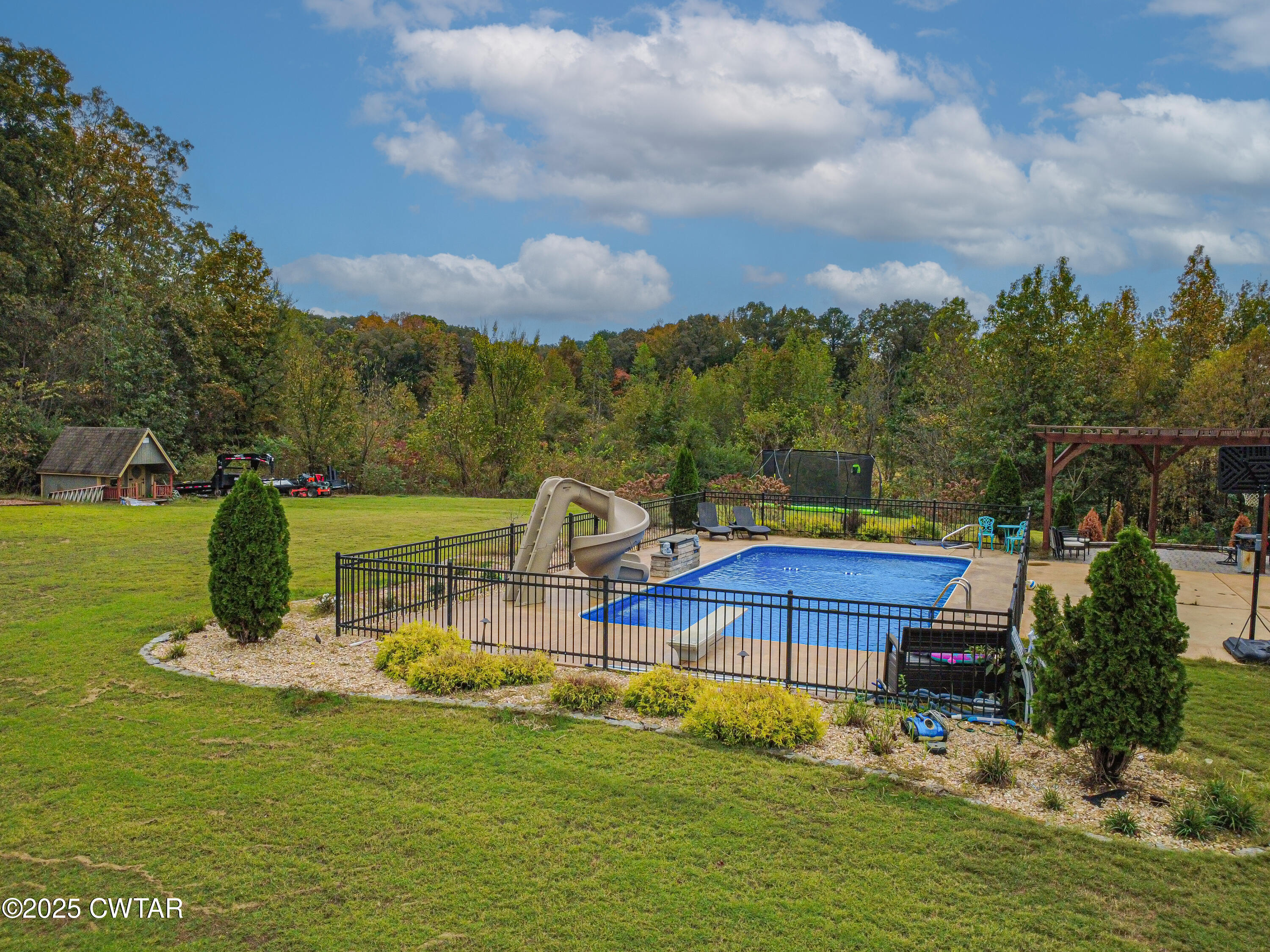 175 Ridgewood Drive Henderson, TN 38340 - Photo 38 of 43 a view of a lake with a house in the background
