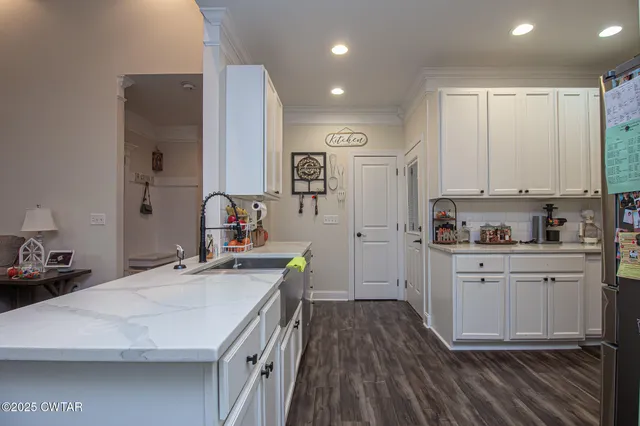a view of a dining room with furniture and window