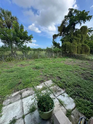 a view of a garden with an outdoor seating