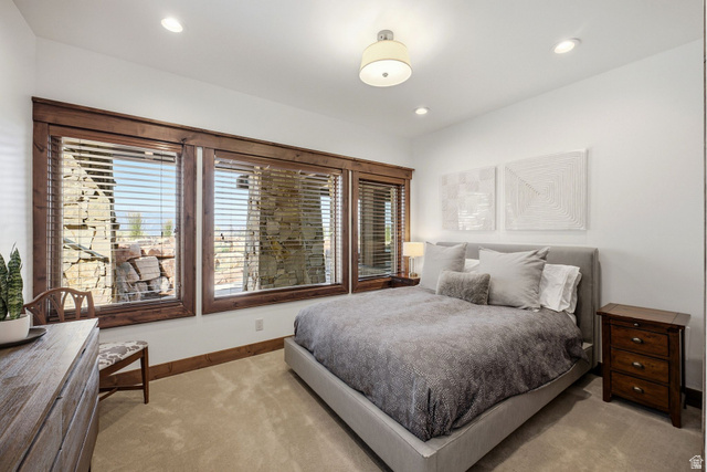 7885 North Rabbitbrush Court, Unit 13 Park City, UT 84098 - Photo 46 of 88 Expansive window array with rich wood trim and stone exterior beyond