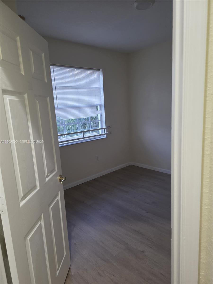 2584 Southwest 84th Terrace, Unit 101 Miramar, FL 33025 - Photo 14 of 19 a view of an empty room with a window