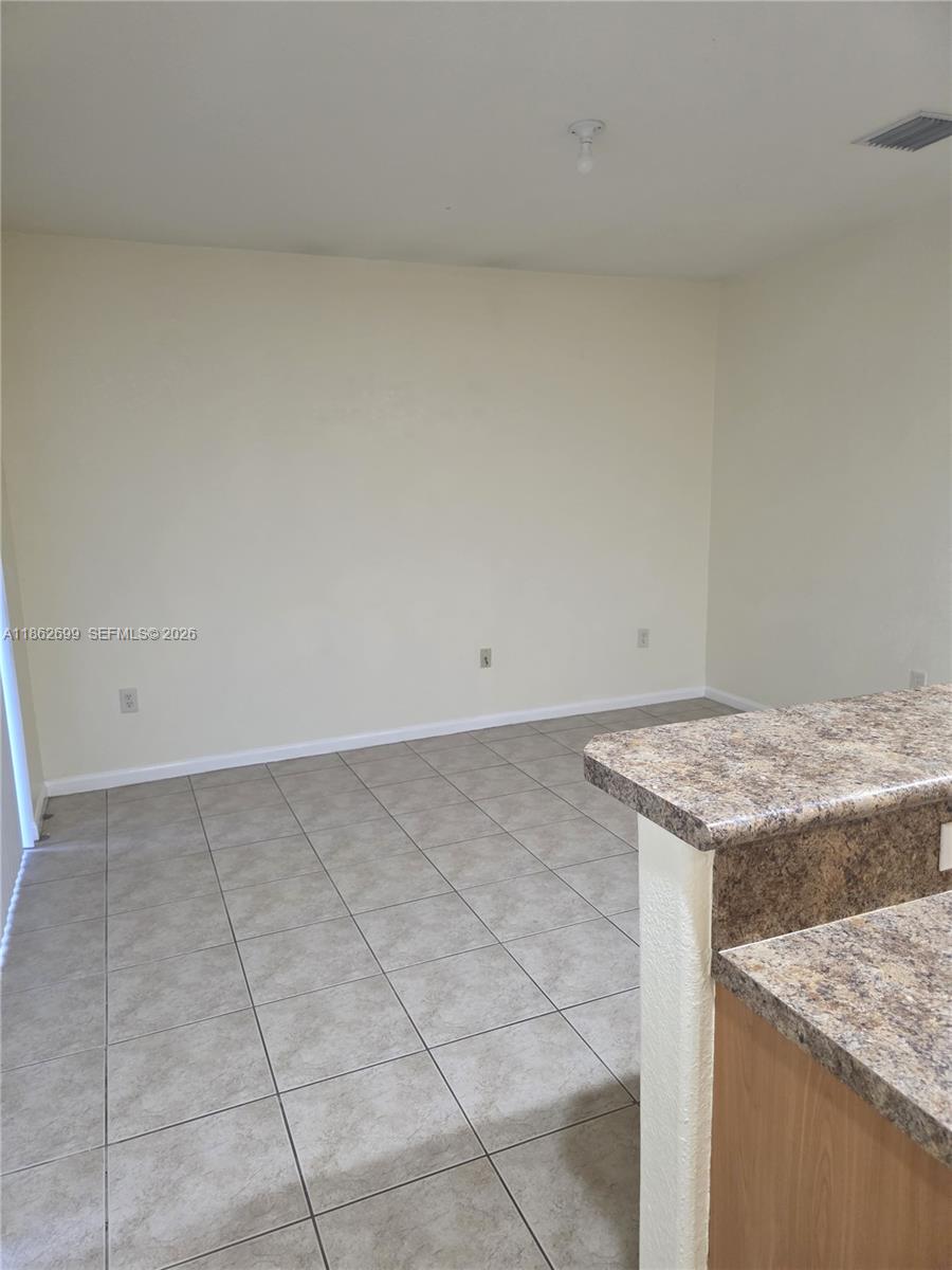 2584 Southwest 84th Terrace, Unit 101 Miramar, FL 33025 - Photo 3 of 19 a view of kitchen cabinets