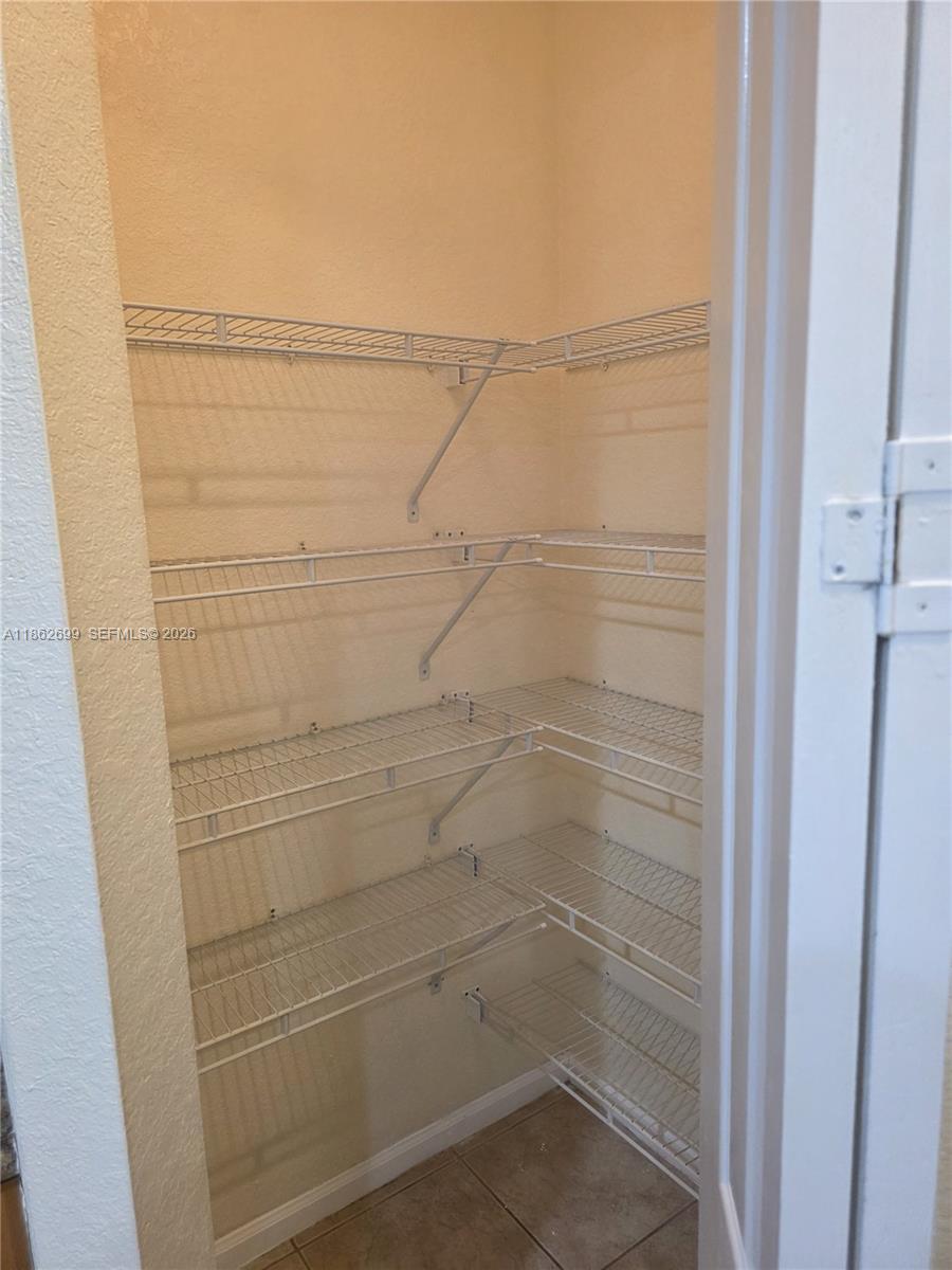 2584 Southwest 84th Terrace, Unit 101 Miramar, FL 33025 - Photo 7 of 19 a bathroom with a shower