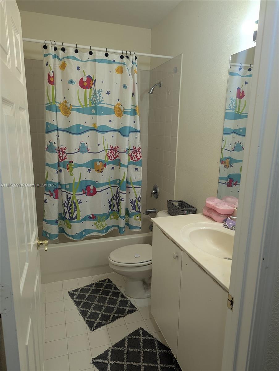 2584 Southwest 84th Terrace, Unit 101 Miramar, FL 33025 - Photo 8 of 11 a bathroom with a sink toilet and shower