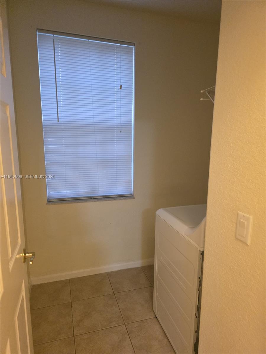 2584 Southwest 84th Terrace, Unit 101 Miramar, FL 33025 - Photo 10 of 19 a bathroom with a granite countertop shower and a sink