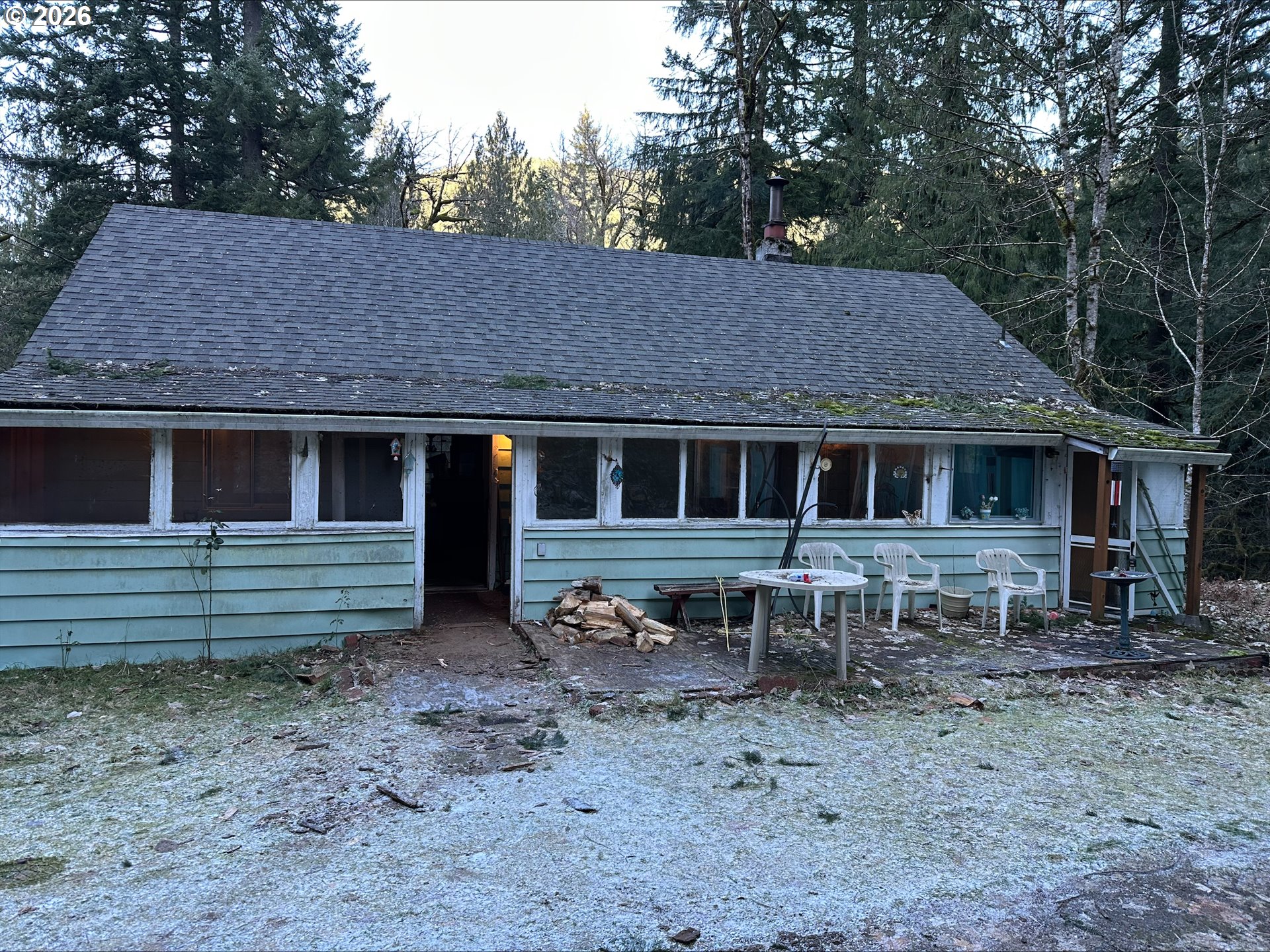 71360 East Jennie Lane Rhododendron, OR 97049 - Photo 2 of 19 a front view of a house with a garden