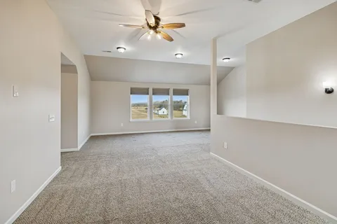 a bedroom with a bed and a table