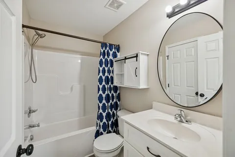 a view of a swimming pool with lounge chairs