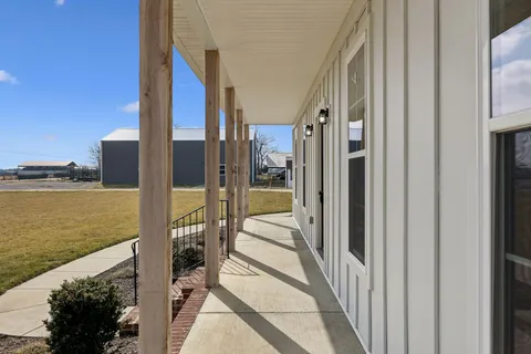 a view of a living room with a wooden floor