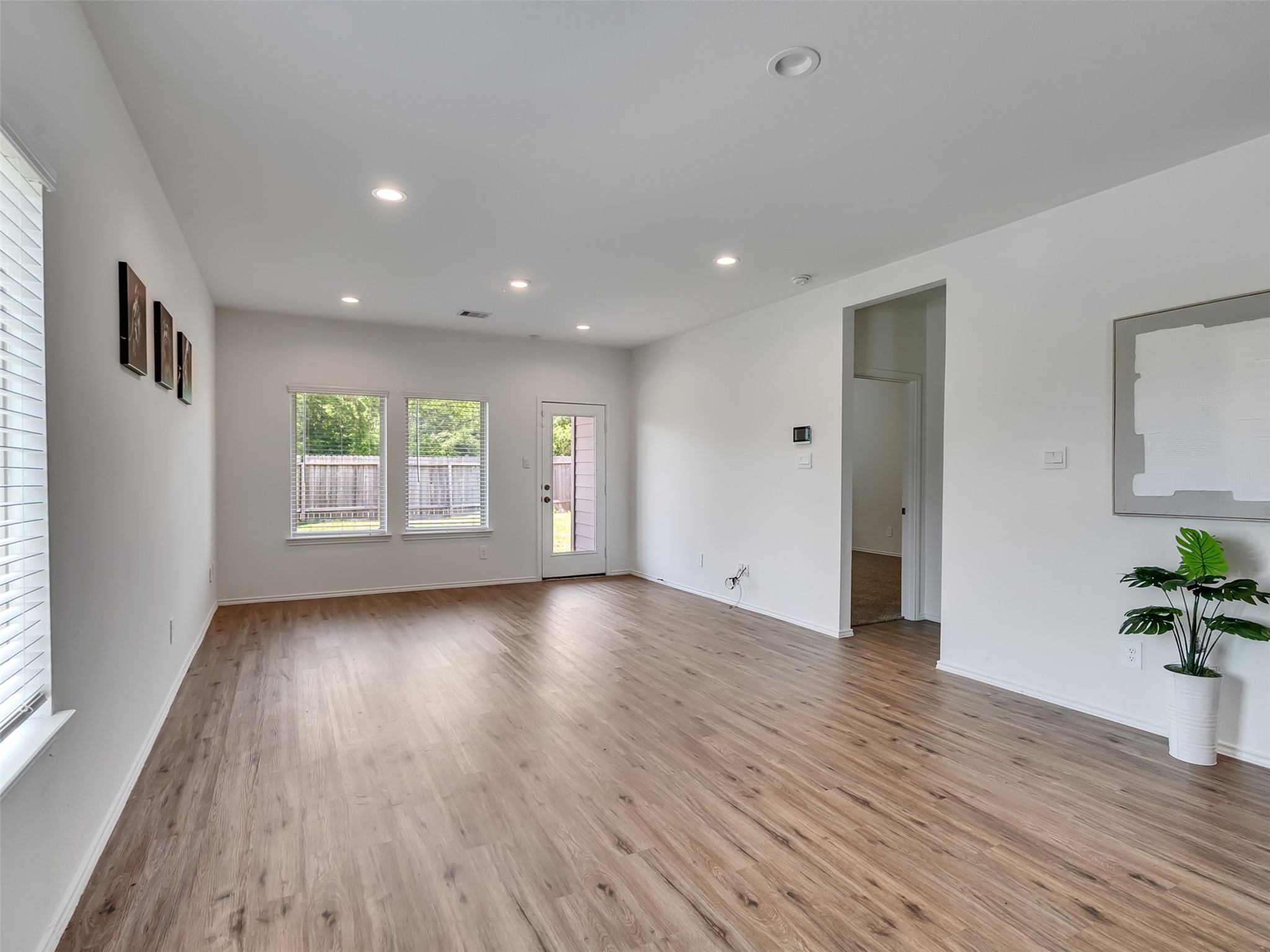 22503 Aspen Tarn Trail Spring, TX 77373 - Photo 8 of 30 a view of an empty room with a window and wooden floor