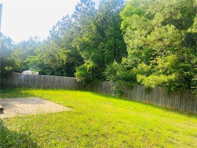 a view of a swimming pool with a lake view