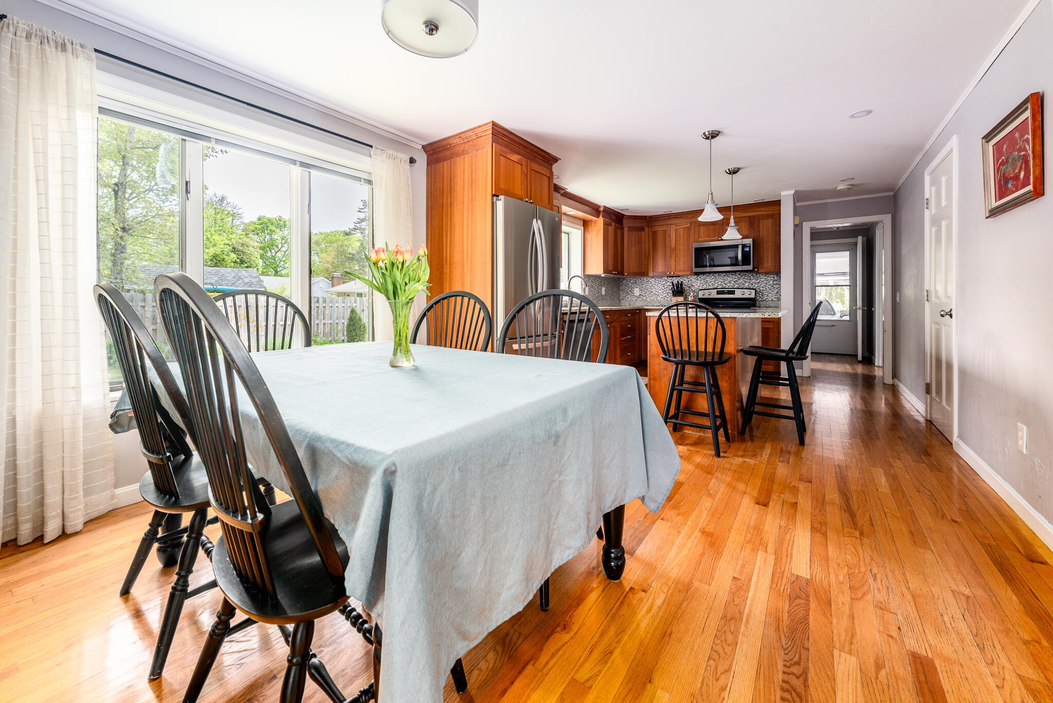 61 Angus Way Centerville, MA 02632 - Photo 16 of 59 a view of a dining room with furniture and wooden floor