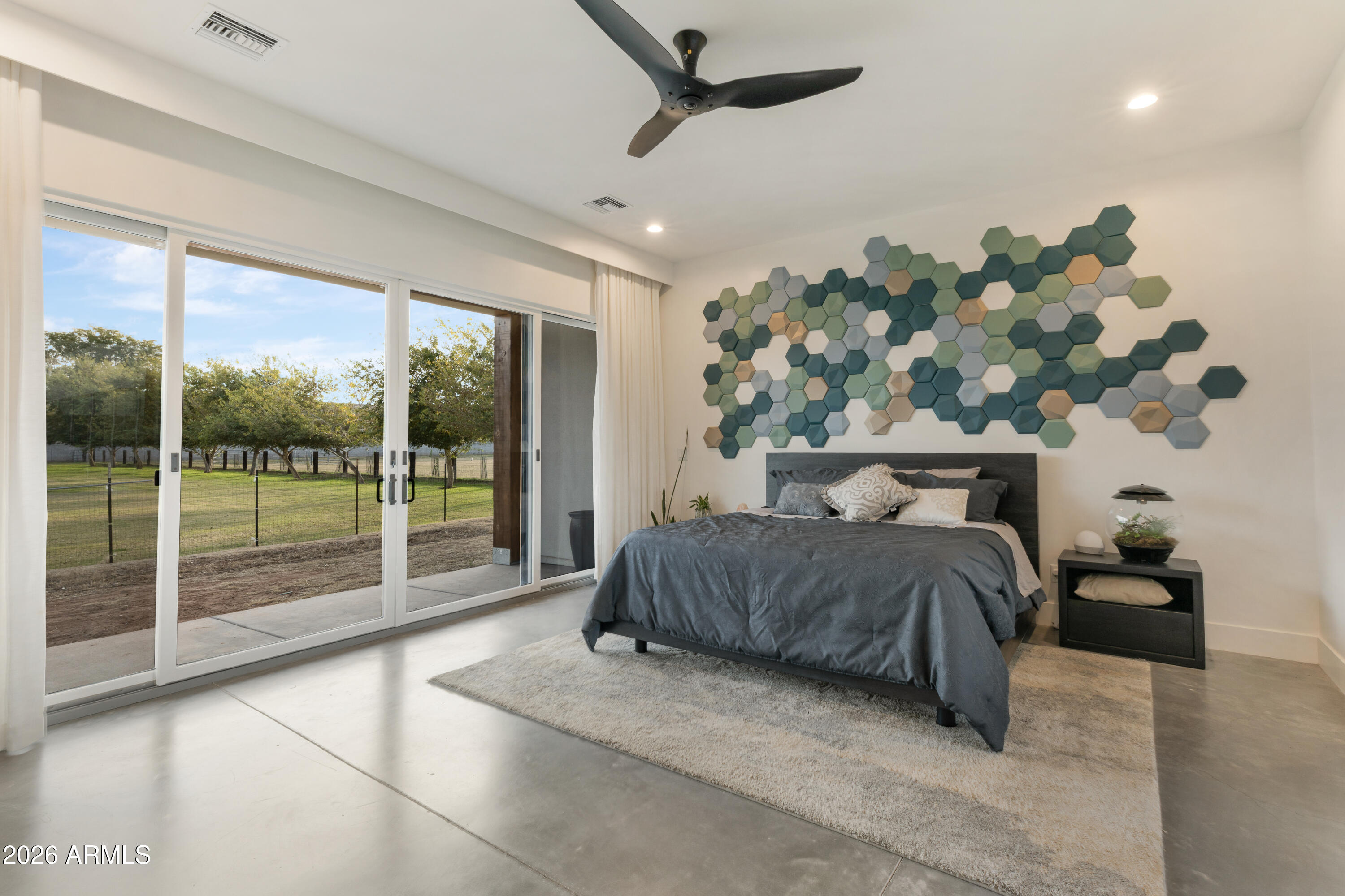 129 East Water Tank Road Gilbert, AZ 85296 - Photo 16 of 48 a bedroom with a bed and a night stand