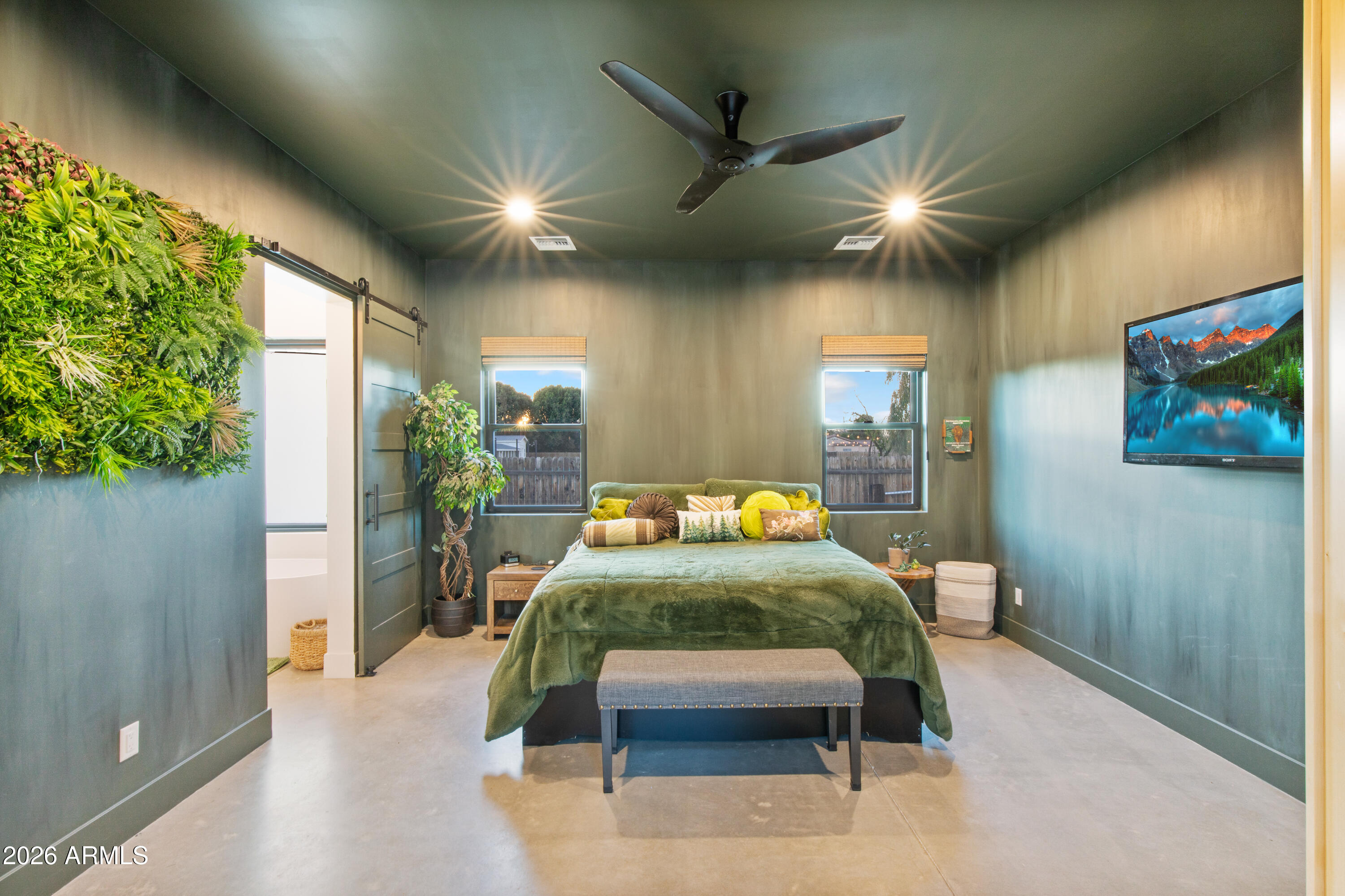 129 East Water Tank Road Gilbert, AZ 85296 - Photo 25 of 48 a bedroom with furniture and a potted plant