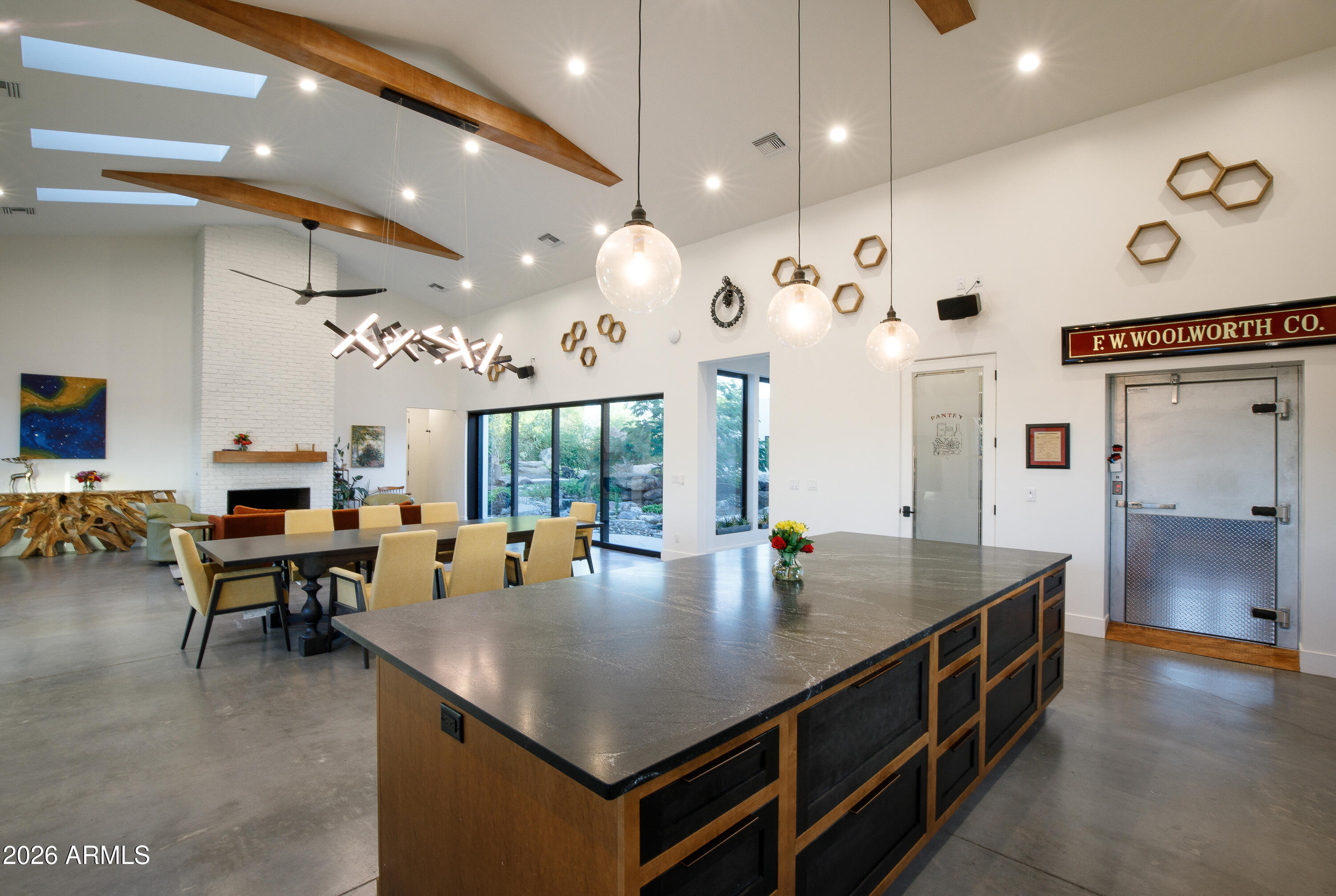 129 East Water Tank Road Gilbert, AZ 85296 - Photo 4 of 48 a open kitchen with a table and chairs in it