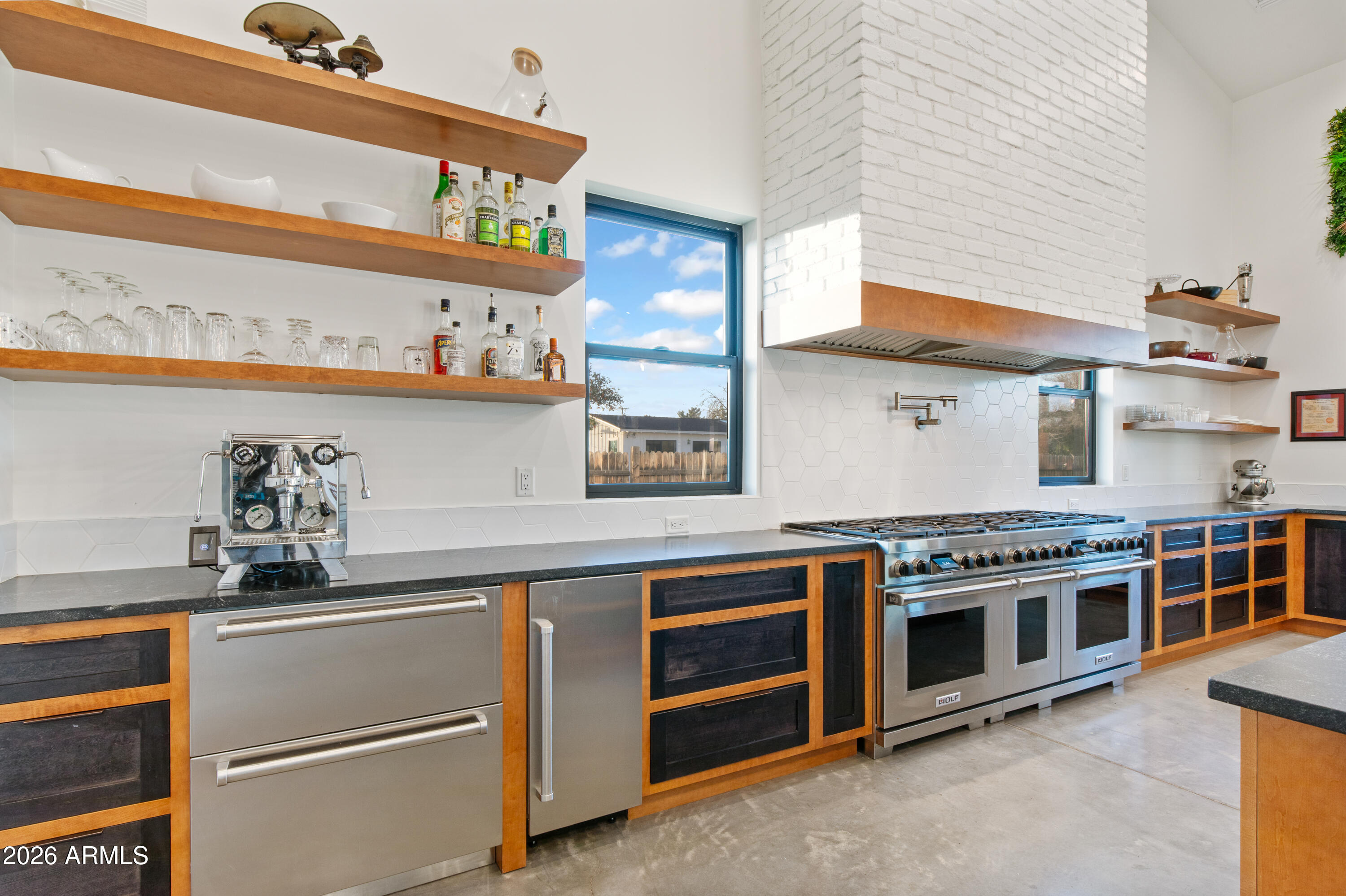 129 East Water Tank Road Gilbert, AZ 85296 - Photo 5 of 48 a kitchen with stainless steel appliances a stove and a sink