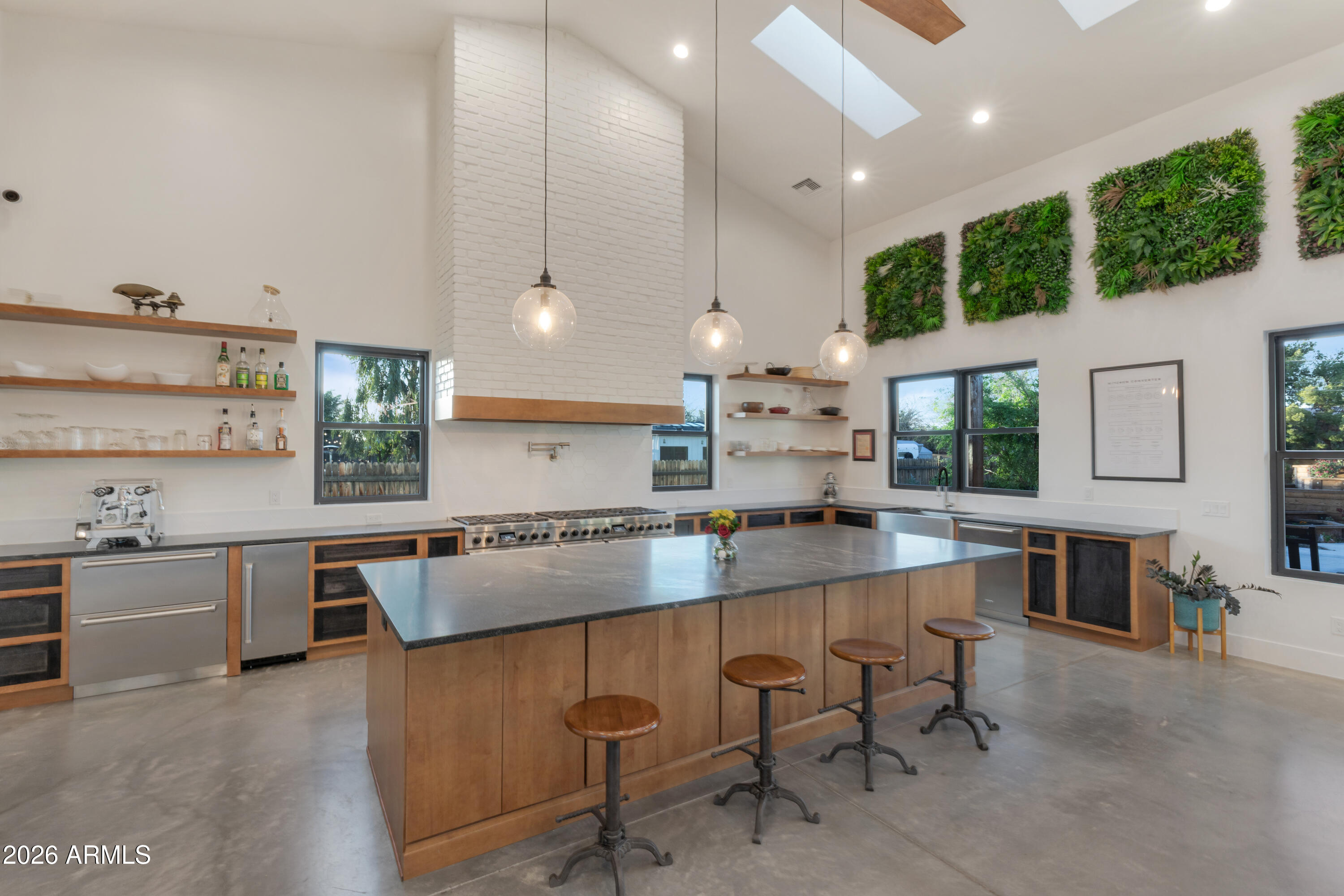 129 East Water Tank Road Gilbert, AZ 85296 - Photo 7 of 48 a large kitchen with kitchen island a large island in it