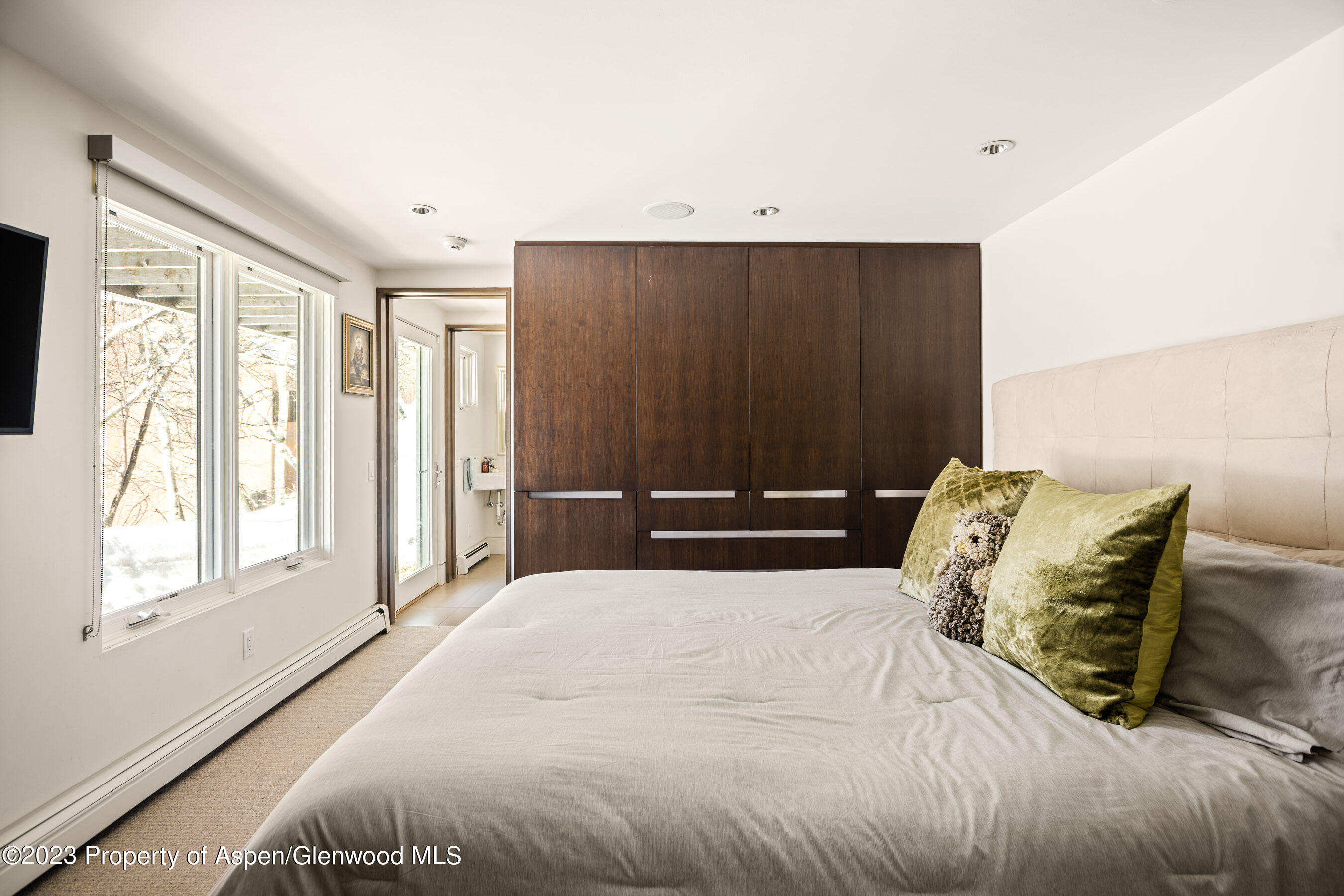 602 Mountain Laurel Drive Aspen, CO 81611 - Photo 14 of 23 a bedroom with a bed and window