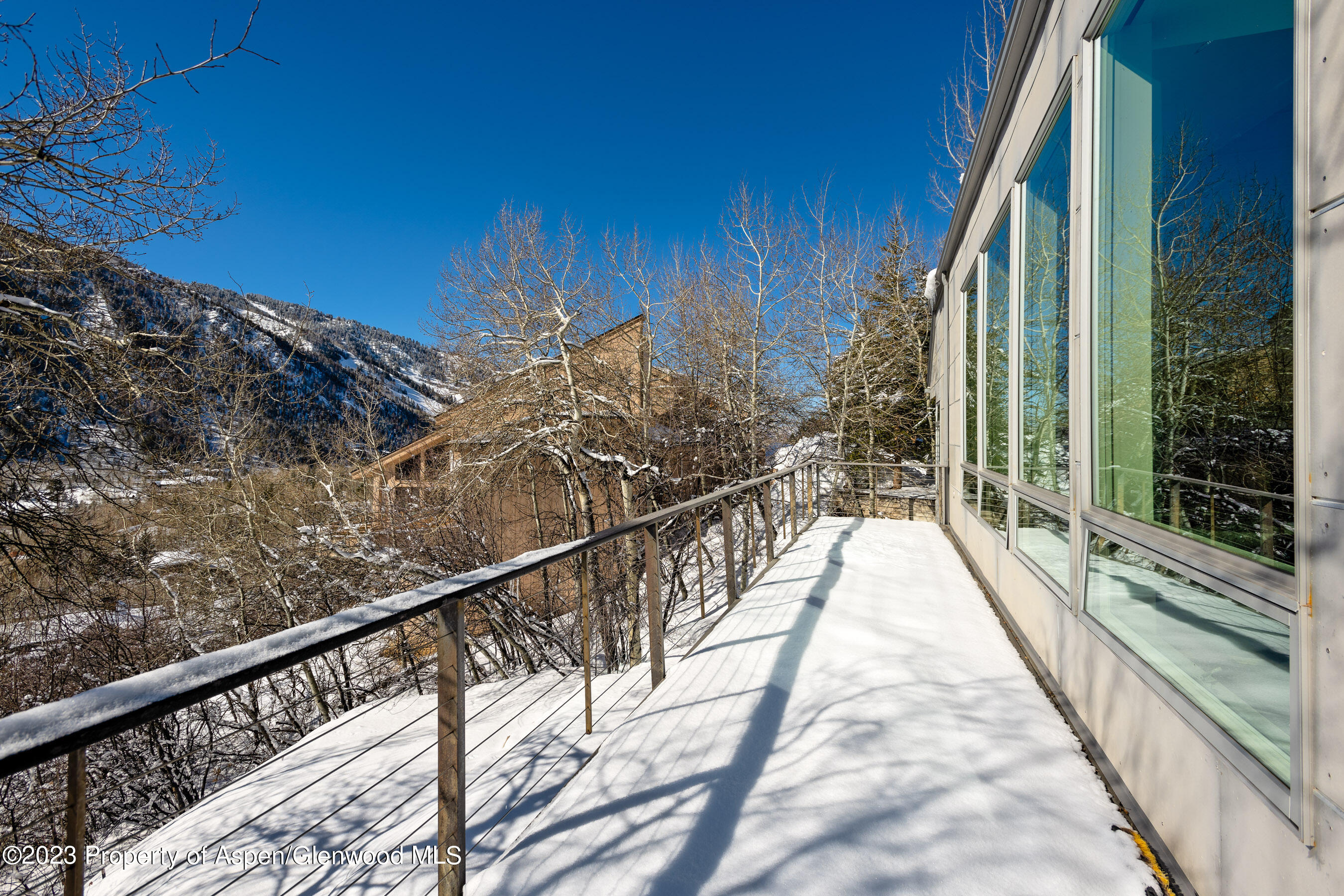 602 Mountain Laurel Drive Aspen, CO 81611 - Photo 19 of 23 a view of balcony with wooden floor and fence