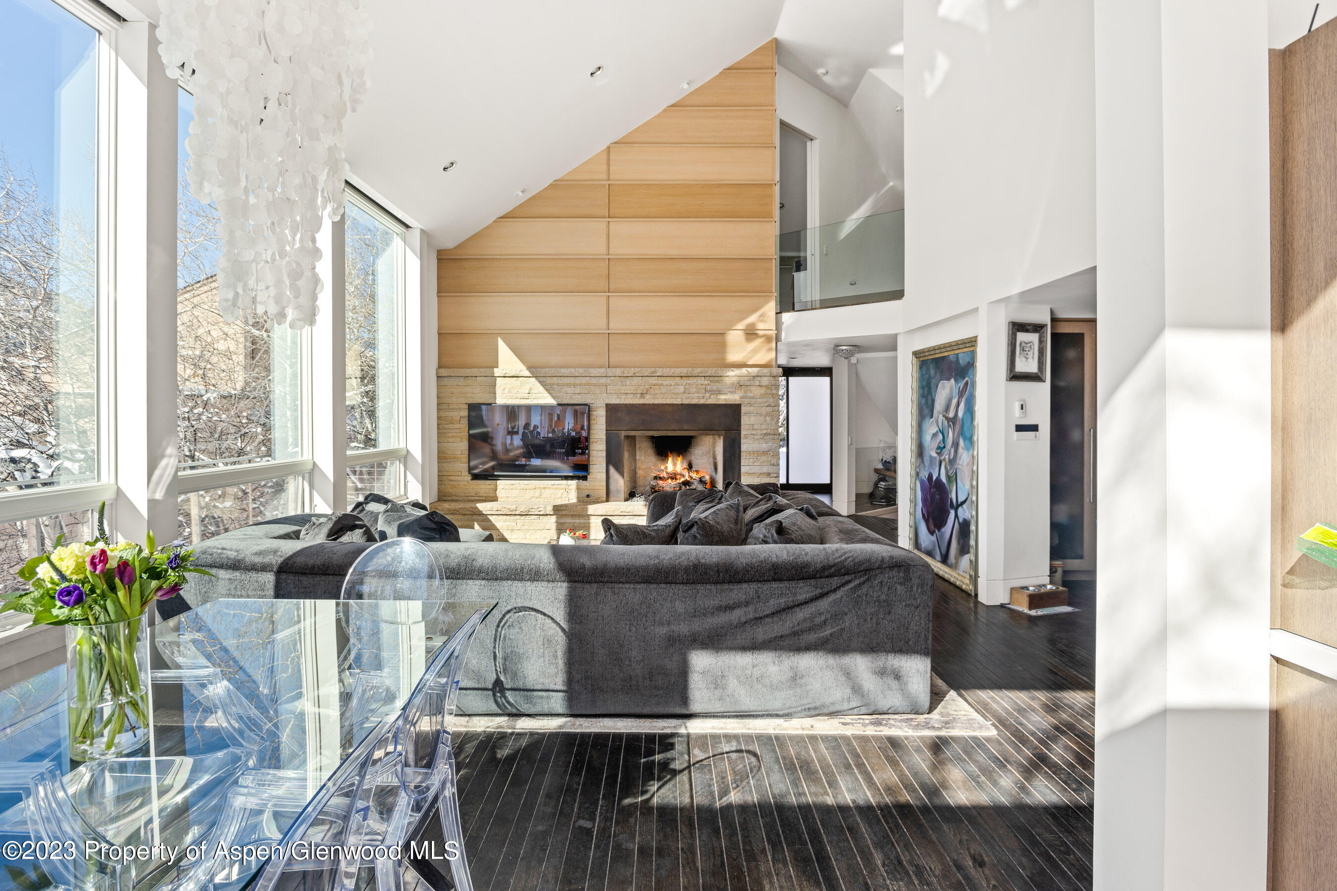 602 Mountain Laurel Drive Aspen, CO 81611 - Photo 4 of 23 a living room with furniture fireplace and a large window