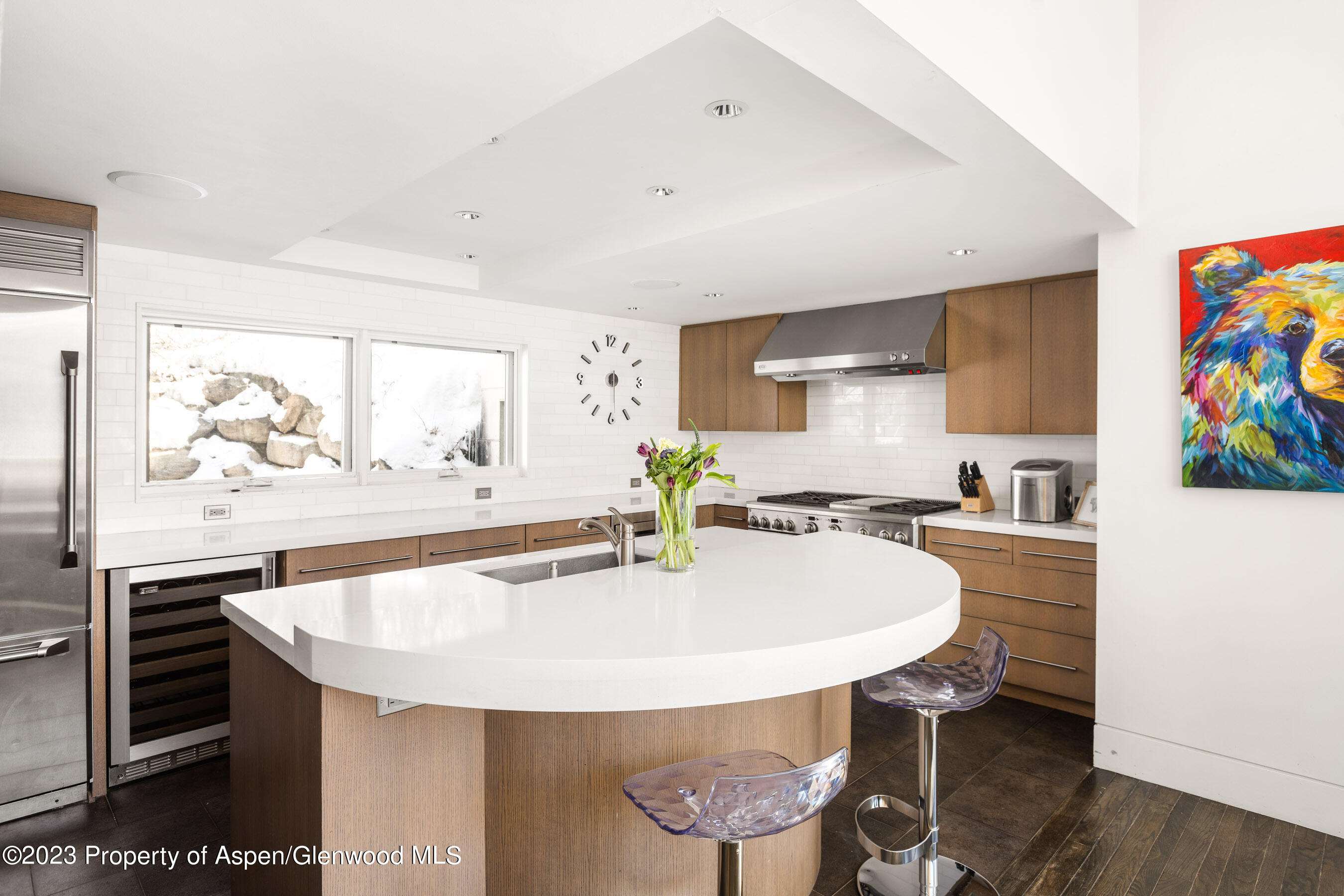 602 Mountain Laurel Drive Aspen, CO 81611 - Photo 7 of 23 a kitchen with stainless steel appliances a dining table and chairs