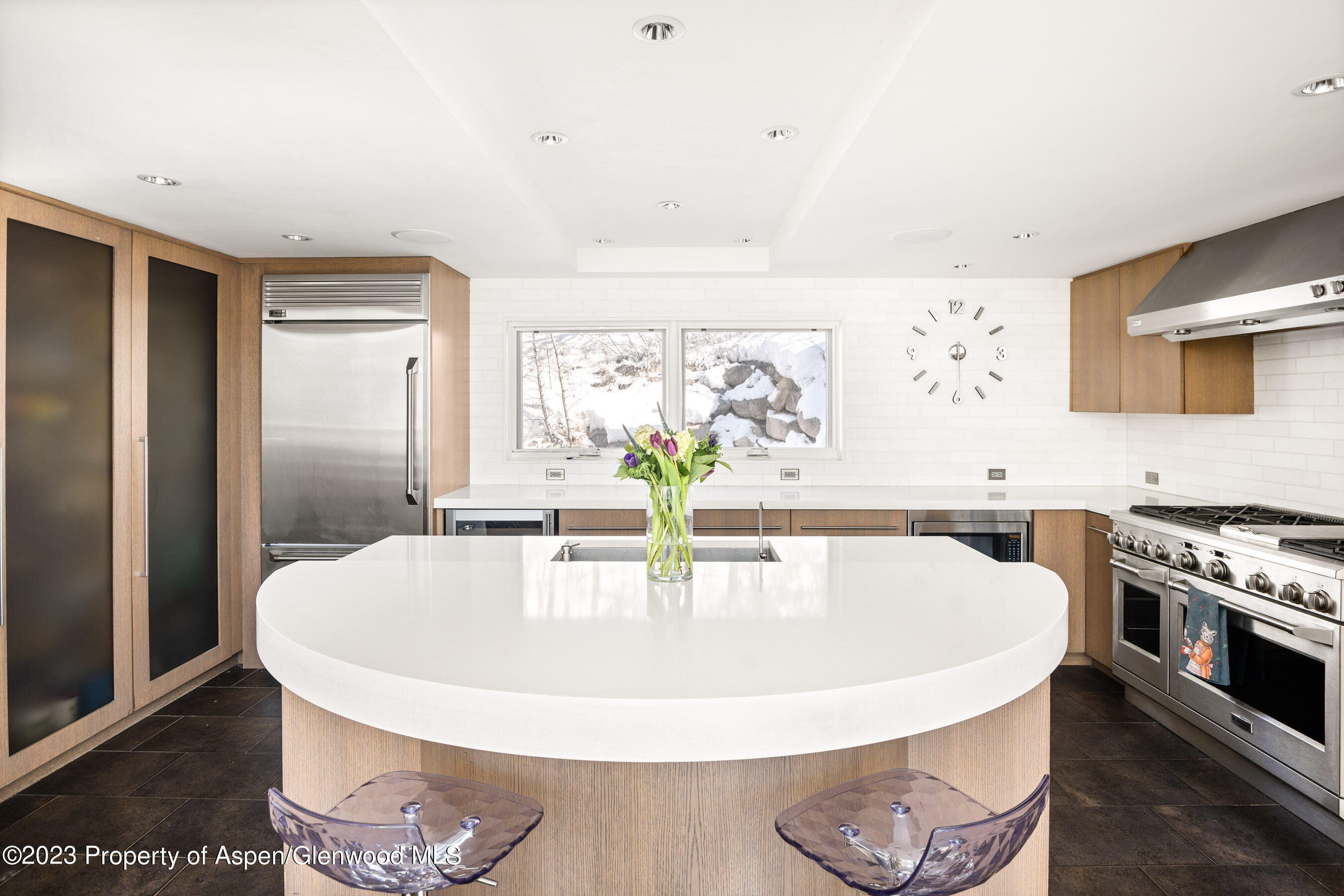 602 Mountain Laurel Drive Aspen, CO 81611 - Photo 8 of 23 a kitchen with a stove and a refrigerator